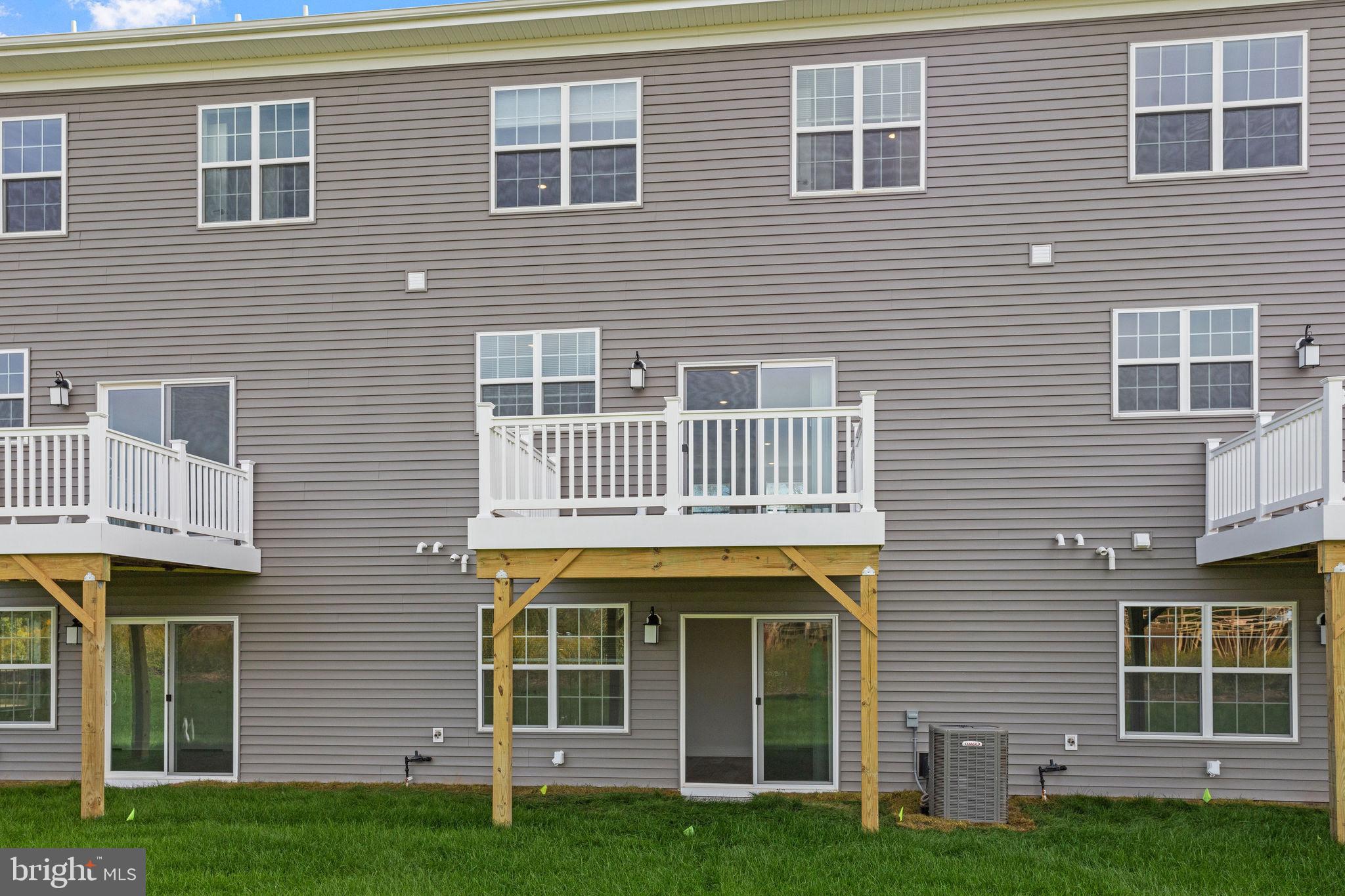 142 ADA Hightower Avenue Pennington, NJ 08534 - Photo 41 of 46 a front view of a house with a yard