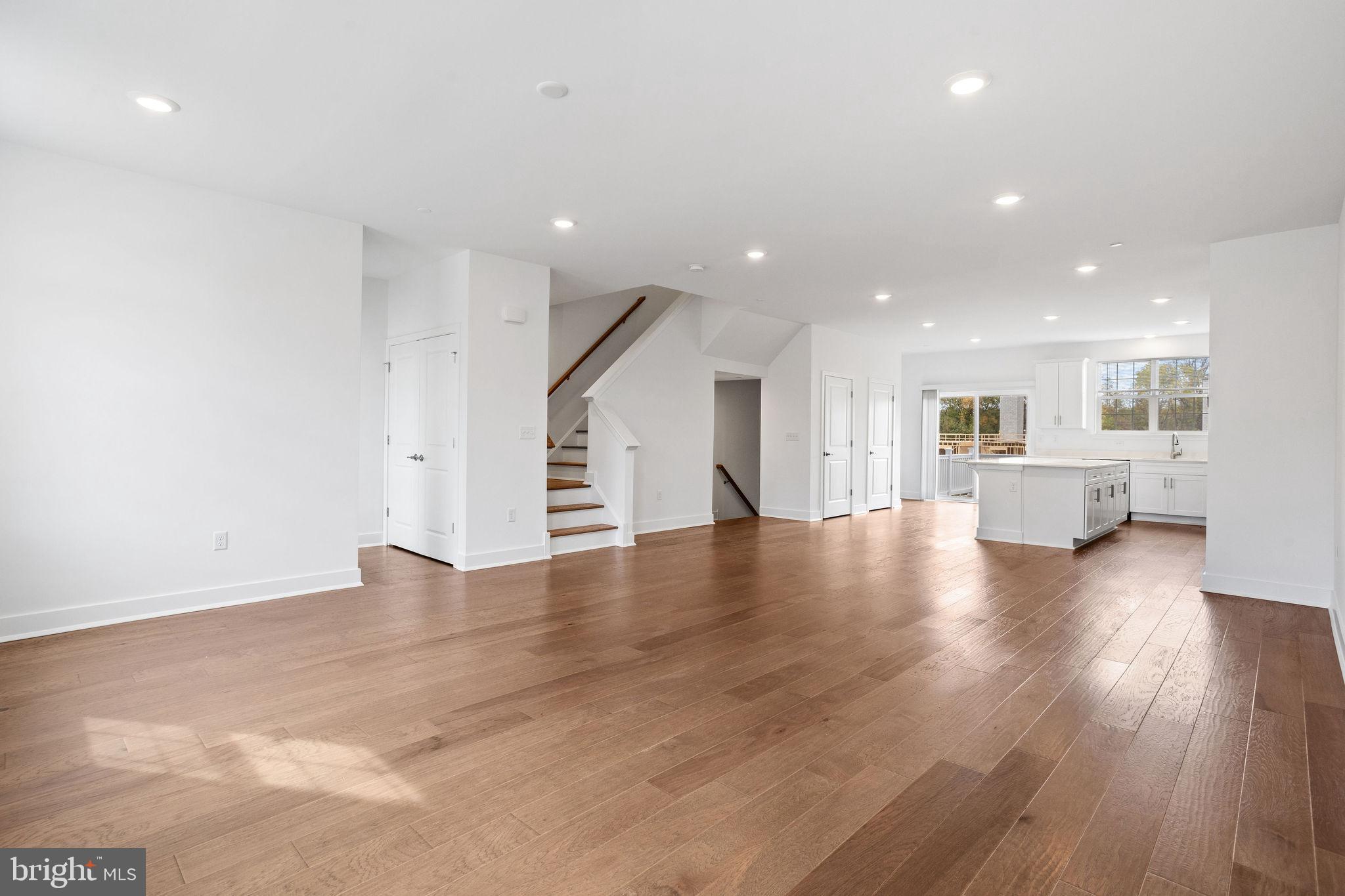 142 ADA Hightower Avenue Pennington, NJ 08534 - Photo 9 of 46 a view of a kitchen with a refrigerator and a stove top oven