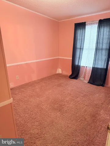 a view of a hallway with a chandelier