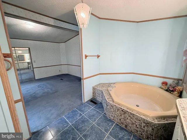 a kitchen with a stove a sink and a refrigerator