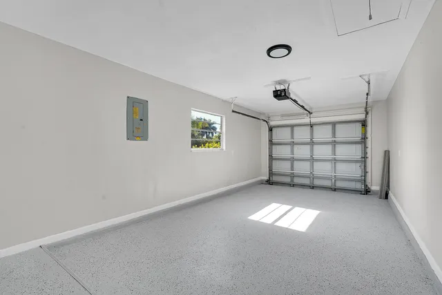 an empty room with windows and natural light