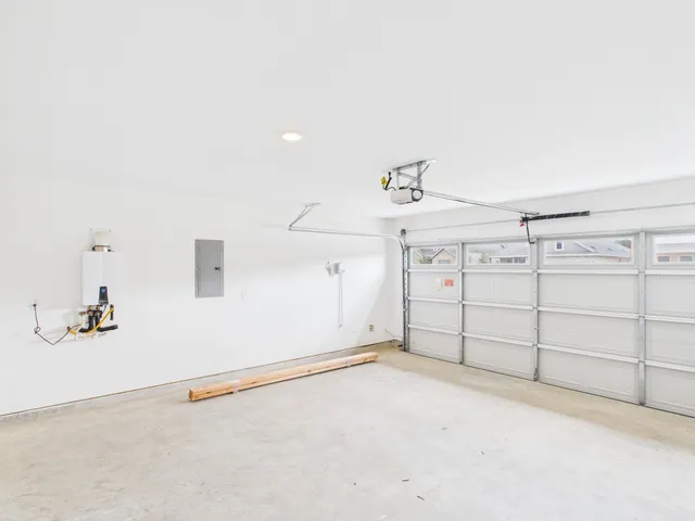 a white toilet sitting next to a white sink