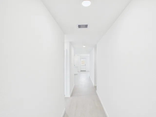 a view of a room with an entryway