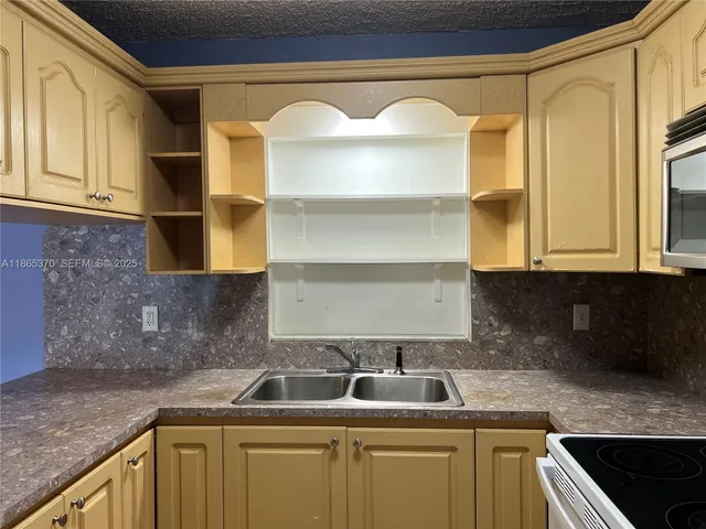 a kitchen with a sink and a cabinets