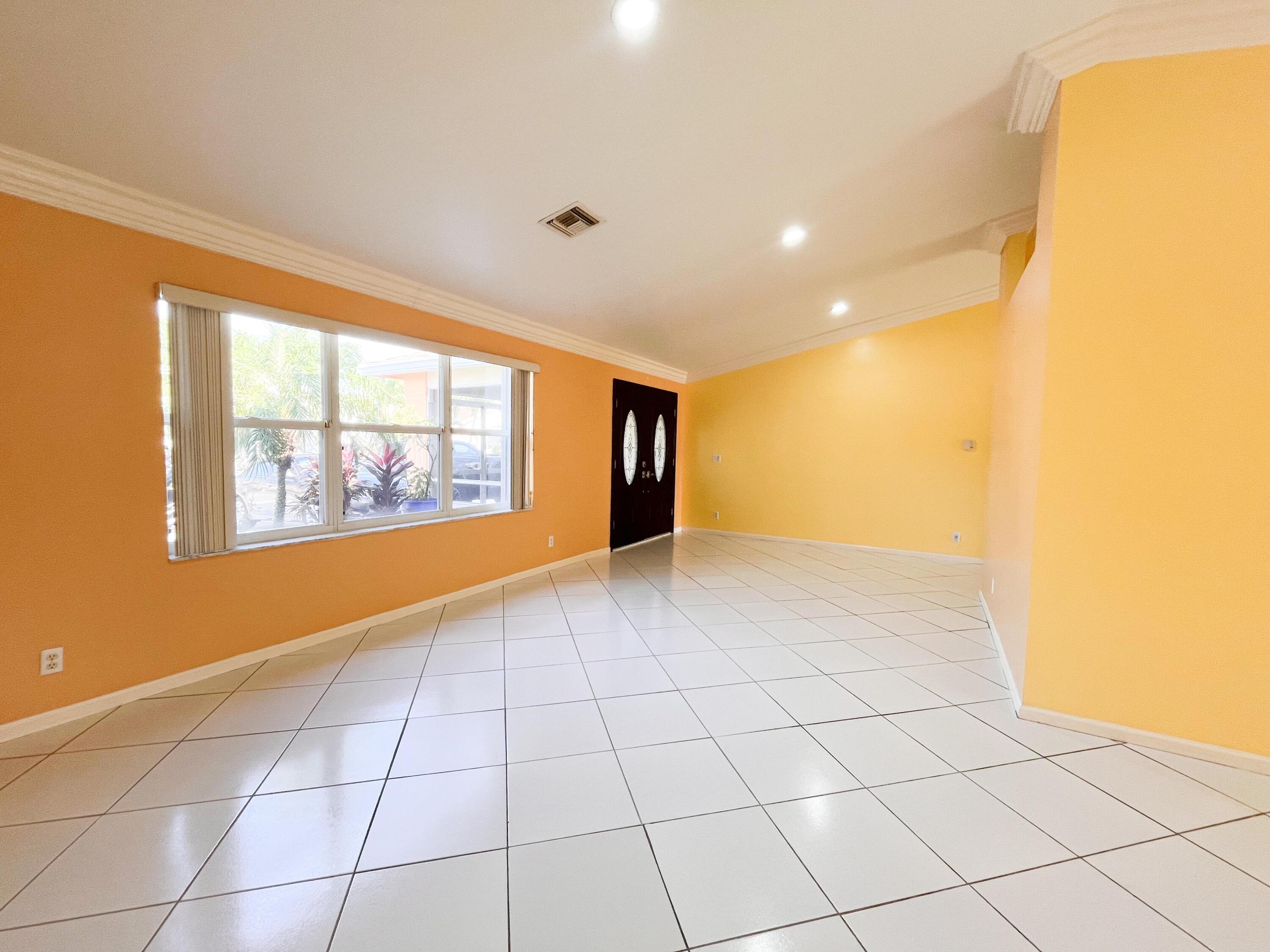 1305 Monteray Way Greenacres, FL 33413 - Photo 11 of 29 a view of an empty room with a window