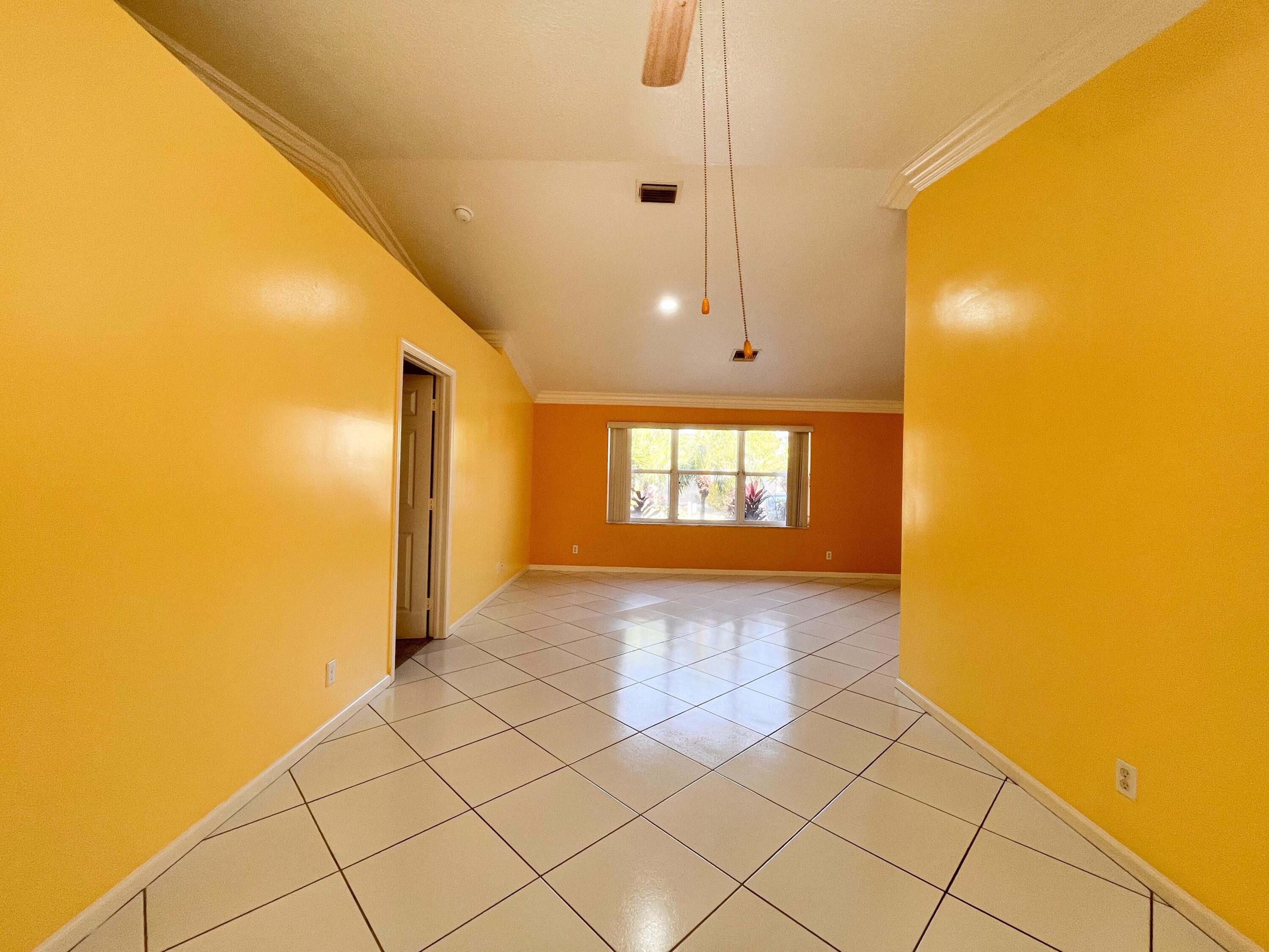 1305 Monteray Way Greenacres, FL 33413 - Photo 10 of 29 a view of a hallway with wooden floor