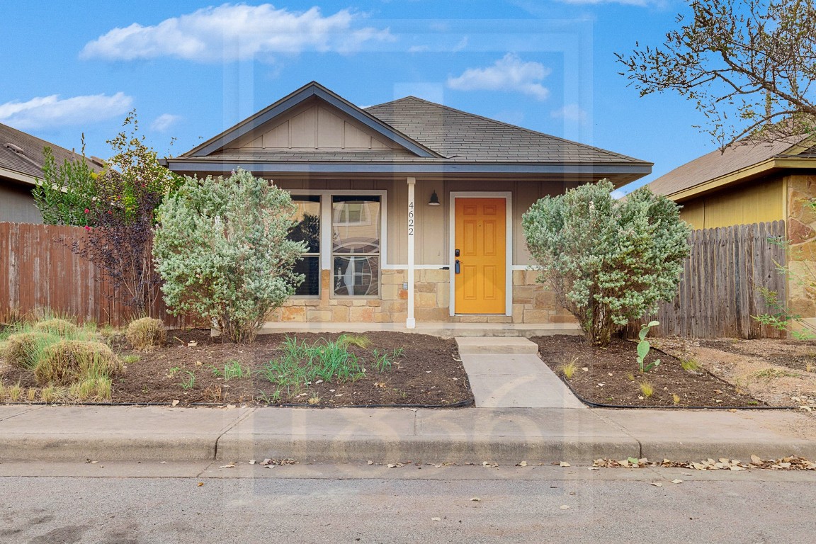 4622 Credo Lane, Unit 167 Austin, TX 78725 - Photo 1 of 25 a front view of a house with garden