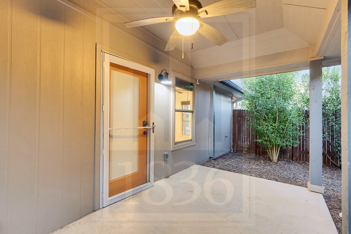 4622 Credo Lane, Unit 167 Austin, TX 78725 - Photo 16 of 25 a view of a big room with windows ceiling fan and front door