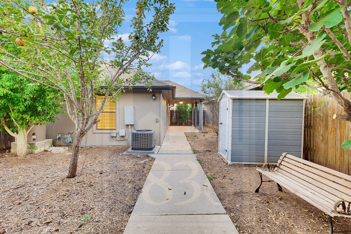 4622 Credo Lane, Unit 167 Austin, TX 78725 - Photo 19 of 25 a front view of a house with garden