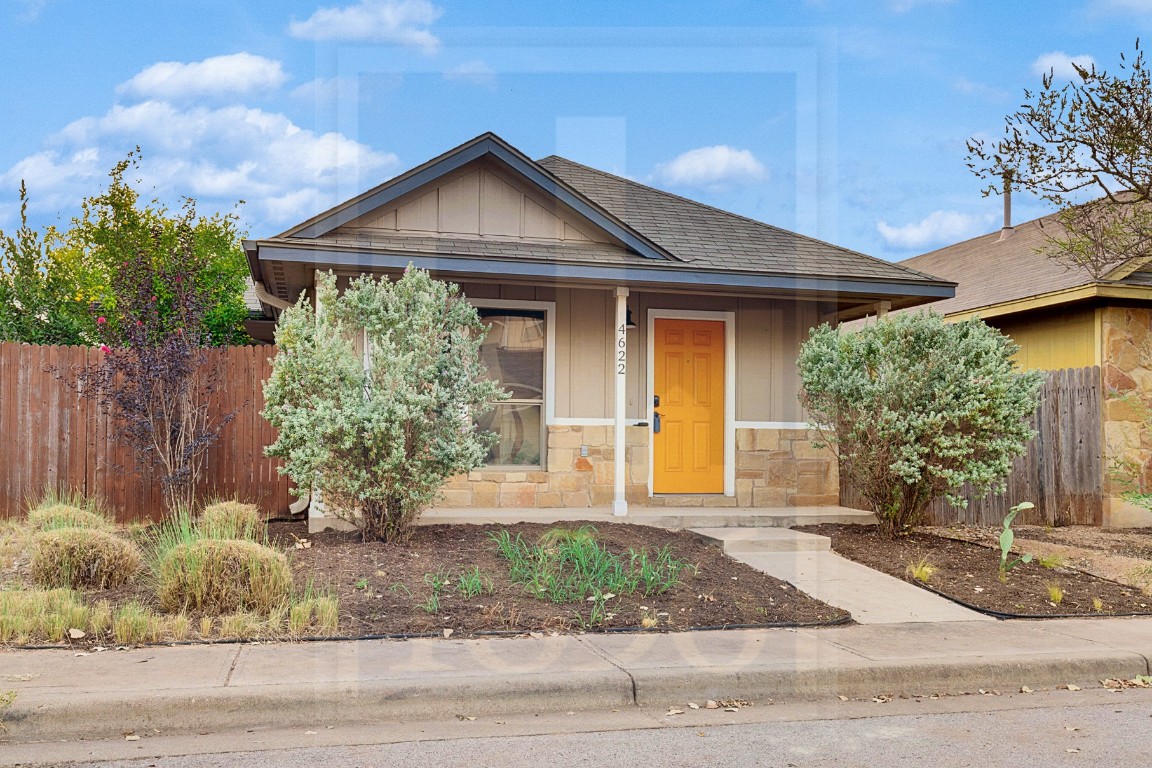 4622 Credo Lane, Unit 167 Austin, TX 78725 - Photo 21 of 25 a front view of a house with garden