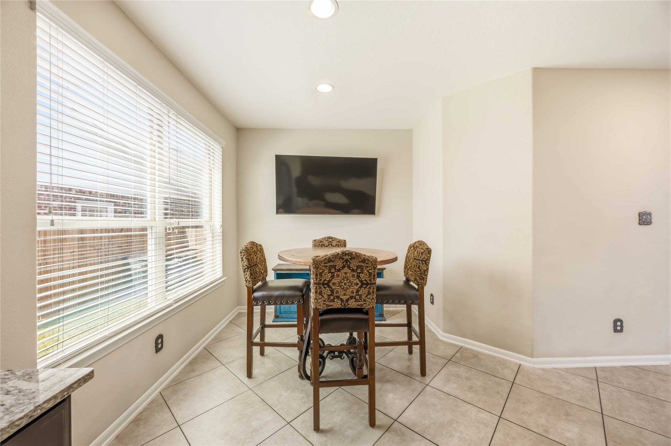 17206 Upper Ridge Lane Humble, TX 77346 - Photo 11 of 33 Breakfast Area – Natural light and views of the backyard, creating an inviting space for everyday meals.