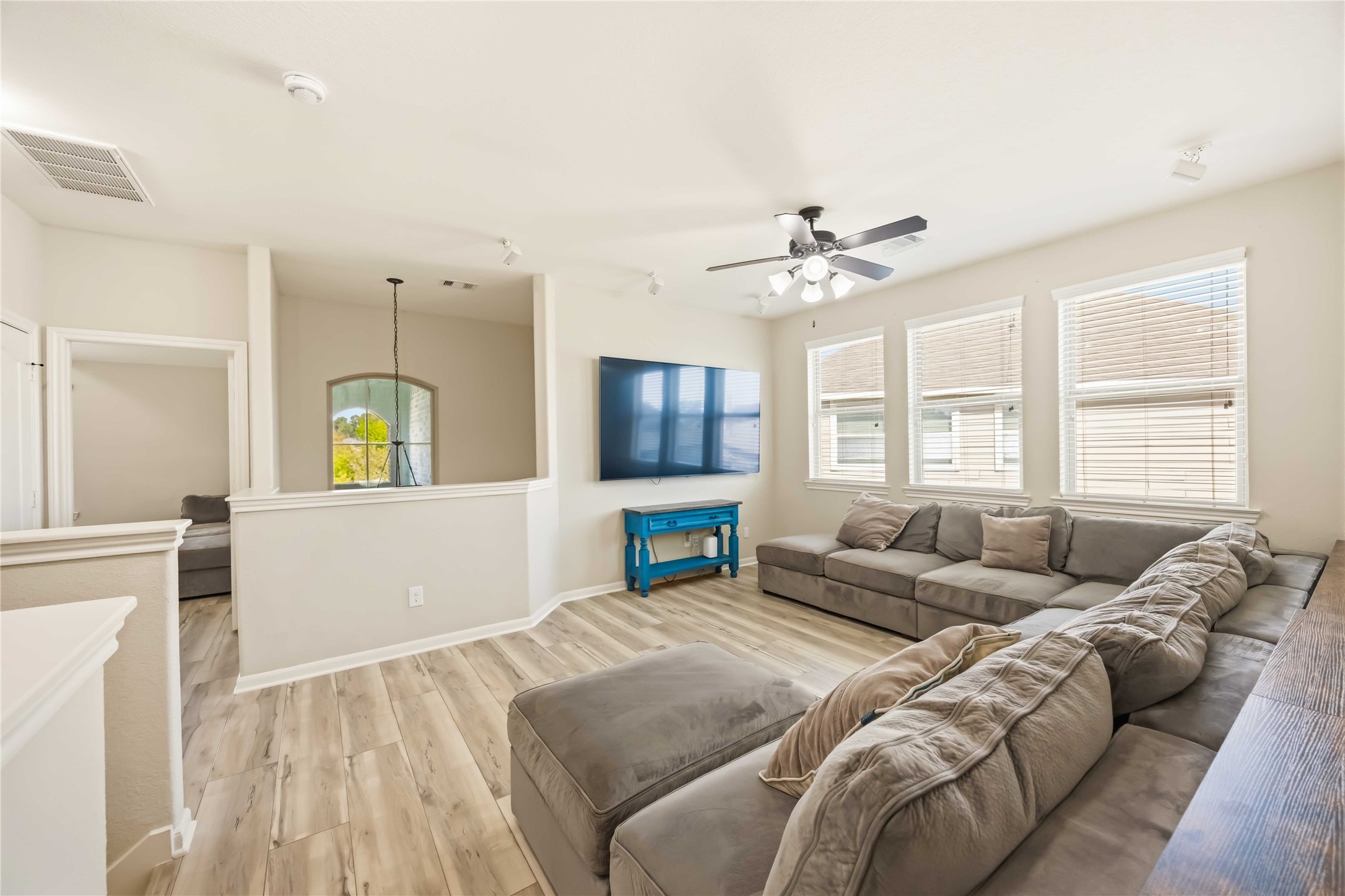 17206 Upper Ridge Lane Humble, TX 77346 - Photo 22 of 33 Game Room (Wide View) – Expansive secondary living space with open sightlines, ceiling fan, and abundant natural light for comfortable everyday living.