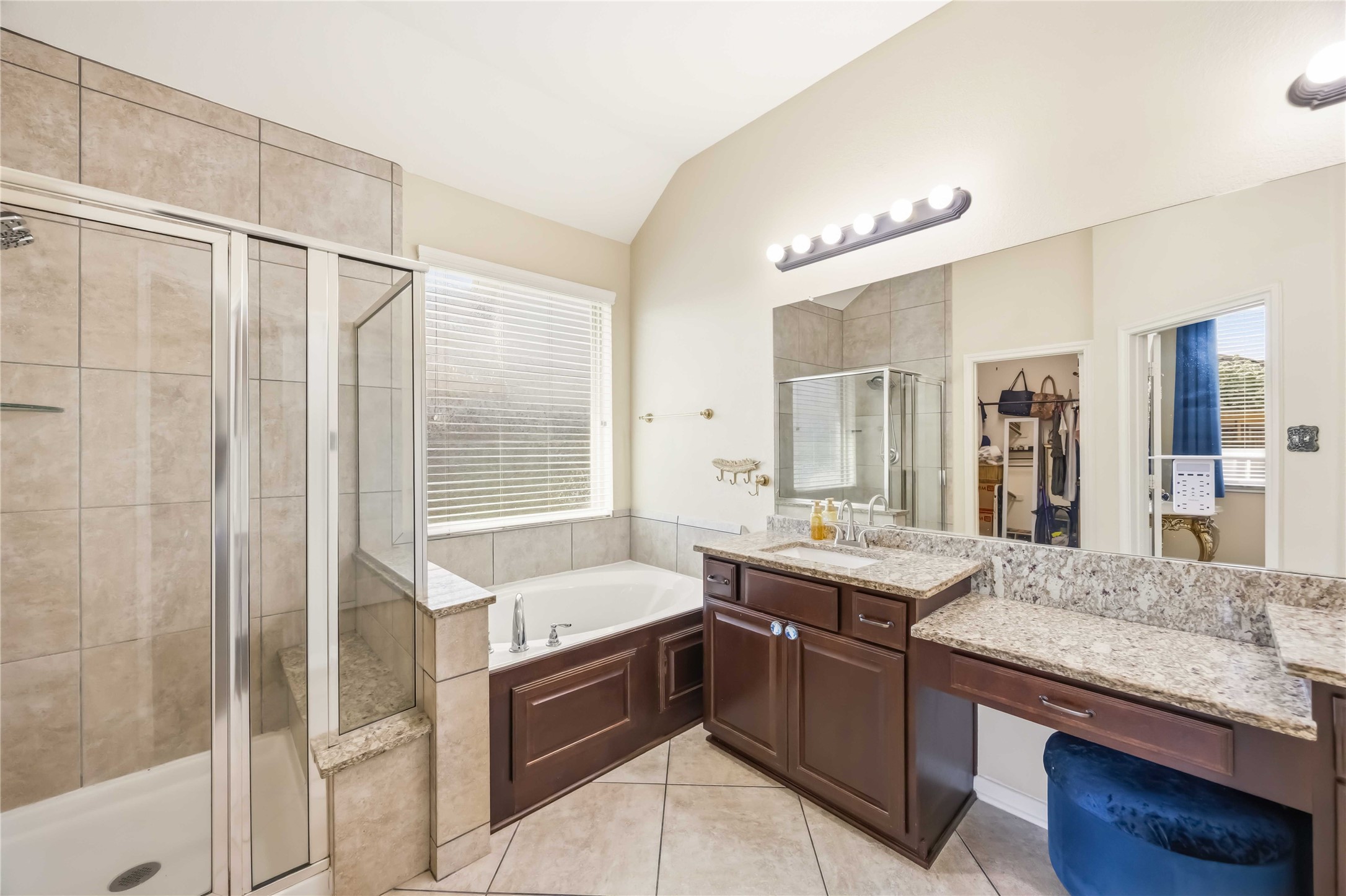 17206 Upper Ridge Lane Humble, TX 77346 - Photo 29 of 33 Primary Bathroom (alternate view)– Spacious en-suite featuring dual vanities, soaking tub, separate shower, and direct access to the walk-in closet.