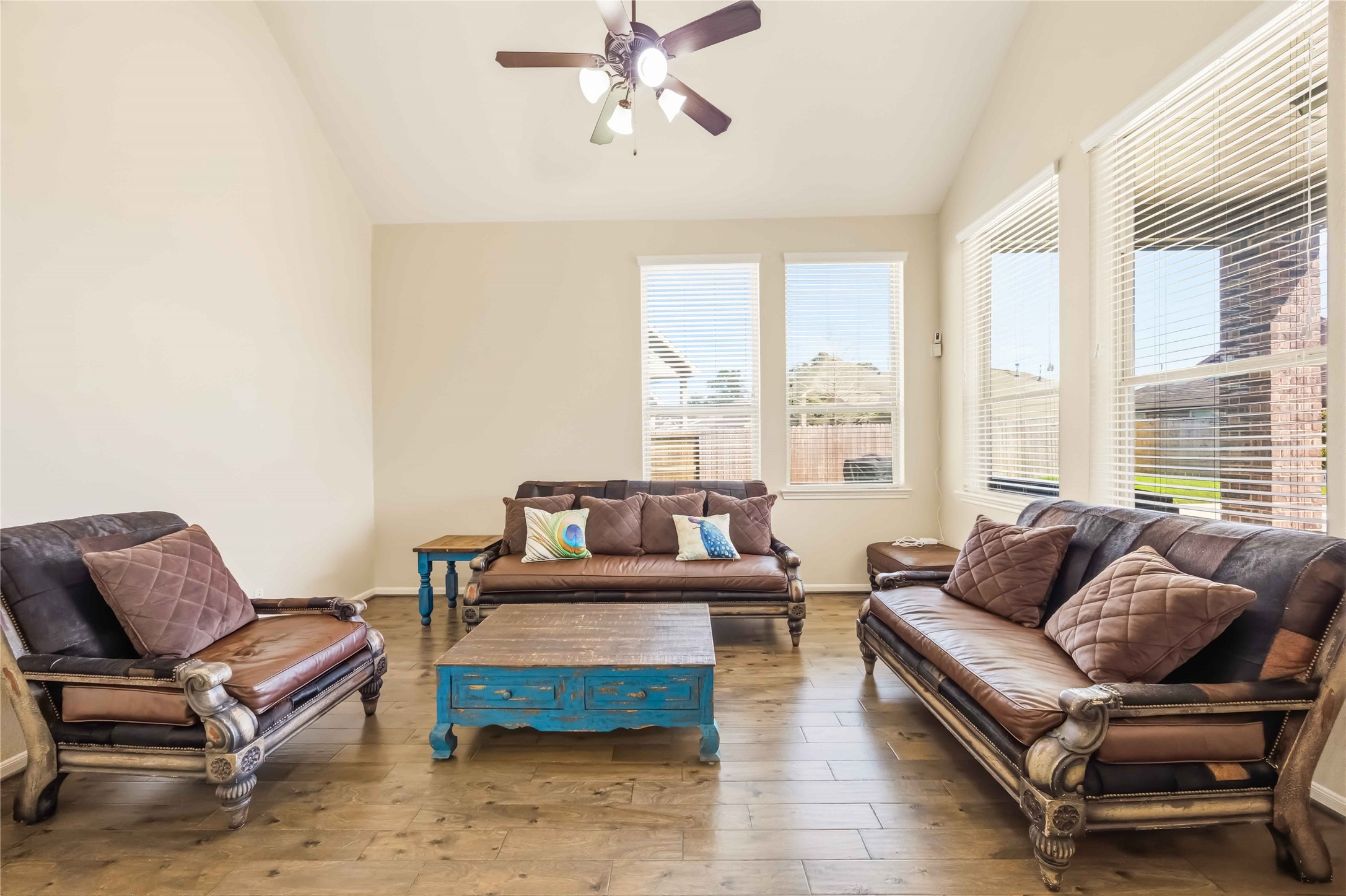 17206 Upper Ridge Lane Humble, TX 77346 - Photo 5 of 33 Living Room (Alternate View) – Open-concept layout seamlessly connects the living room to adjacent spaces, enhanced by large windows and airy ceilings.