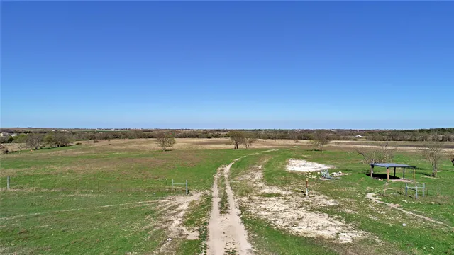a view of a lake with a yard