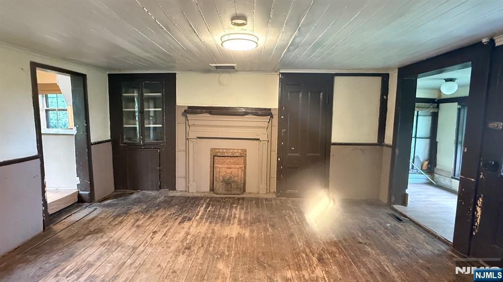 25 Coleman Hill Road Washington, NJ 07882 - Photo 13 of 18 wooden floor in an empty room with a kitchen
