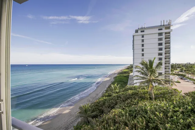 a view of a tall building with a yard