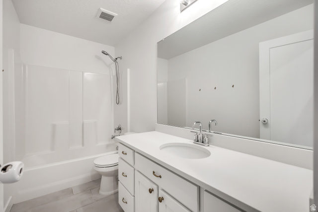 1058 Lilac Way Mapleton, UT 84664 - Photo 21 of 28 Full bathroom with vanity, bathing tub / shower combination, and light tile patterned flooring