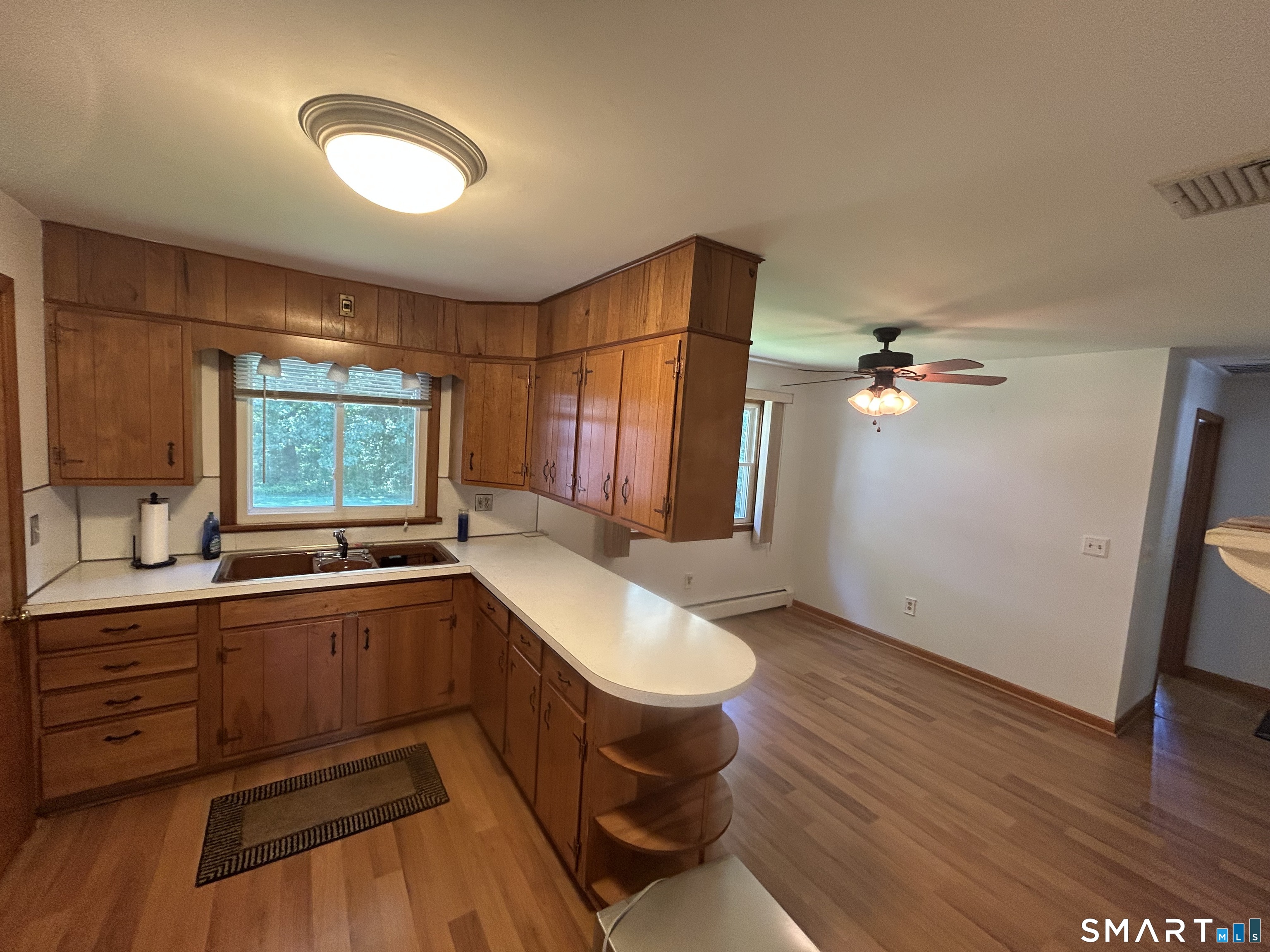 13 Walnut Lane Wallingford, CT 06492 - Photo 6 of 27 a kitchen with a sink appliances and cabinets