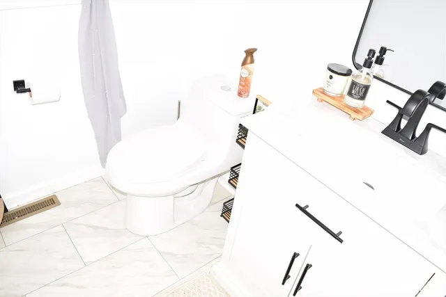 a bathroom with a sink and mirror