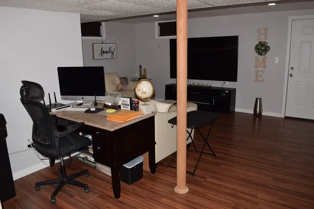 a view of a workspace with furniture