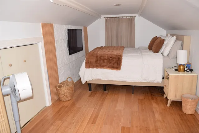 a bedroom with a bed and a table in it