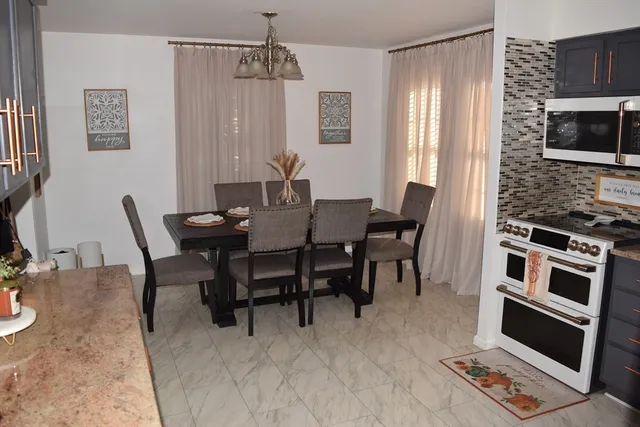 a view of a dining room with furniture