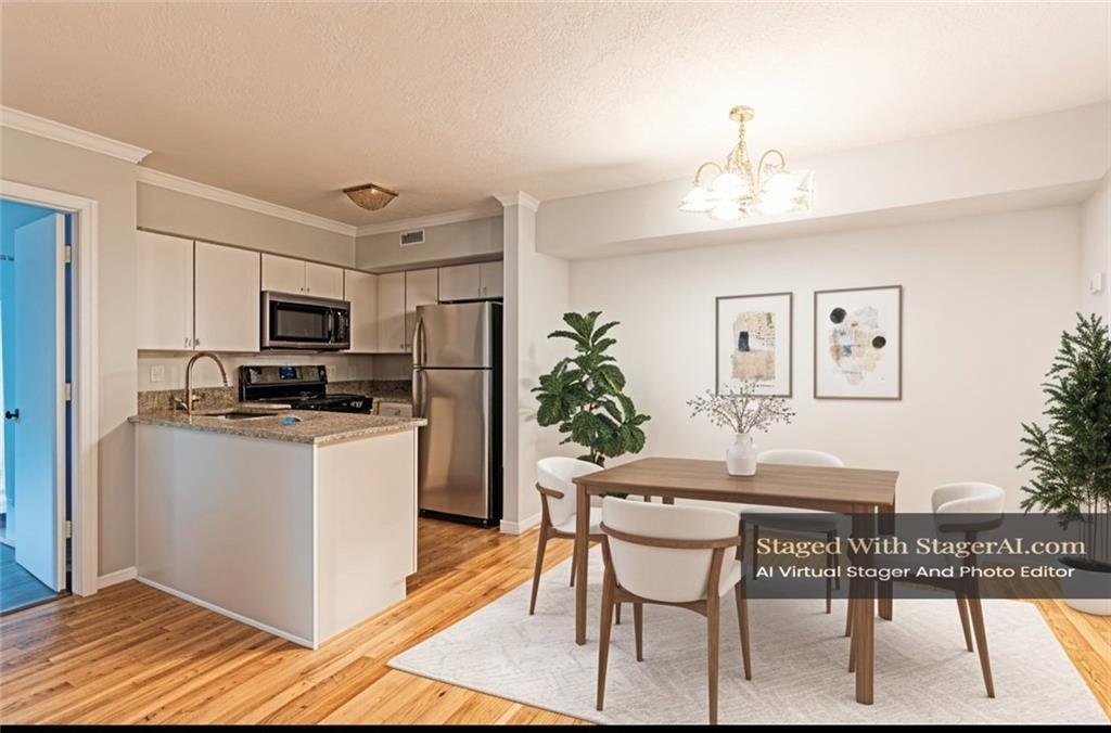 1941 Brian Way, Unit 1941 Decatur, GA 30033 - Photo 1 of 1 a kitchen with kitchen island granite countertop a sink cabinets and refrigerator