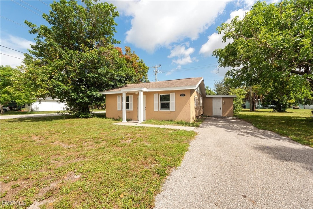 1905 Oakley Avenue, Unit A AND B Fort Myers, FL 33901 - Photo 1 of 30 a front view of house with yard and trees