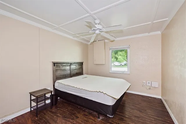 a bedroom with a bed and a table