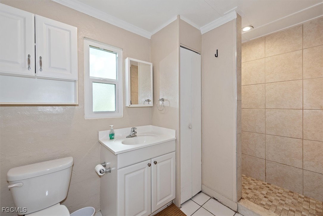 1905 Oakley Avenue, Unit A AND B Fort Myers, FL 33901 - Photo 13 of 30 a bathroom with a toilet sink and mirror