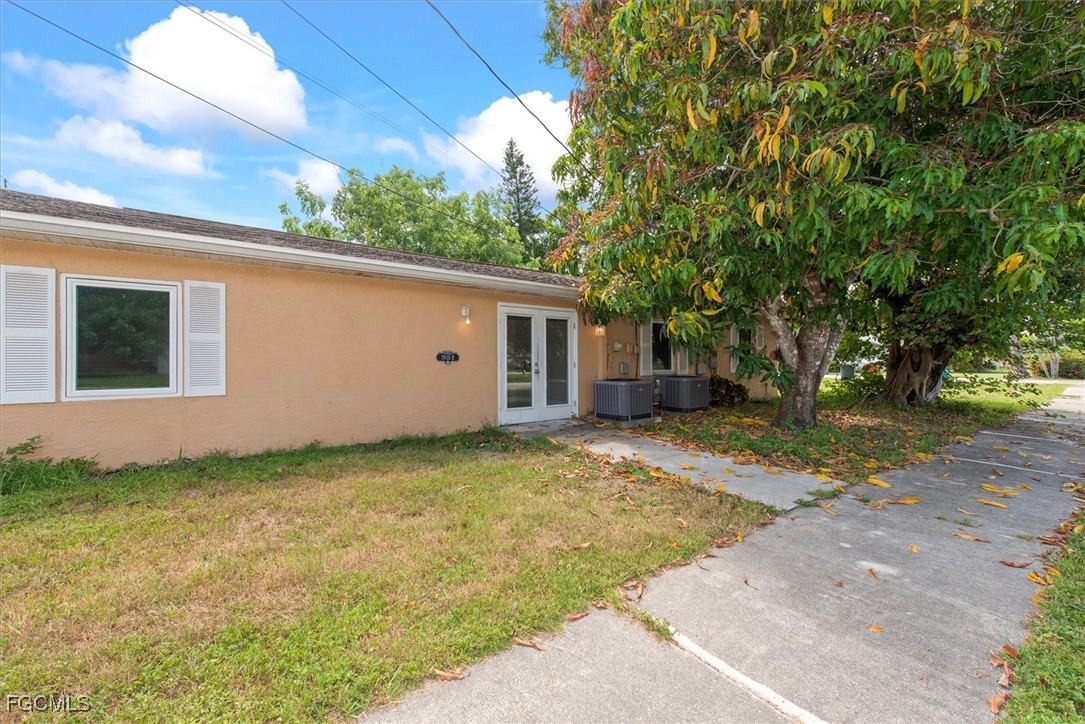 1905 Oakley Avenue, Unit A AND B Fort Myers, FL 33901 - Photo 15 of 30 a view of a backyard with a garden and tree