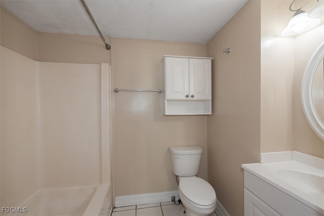 1905 Oakley Avenue, Unit A AND B Fort Myers, FL 33901 - Photo 24 of 30 a white toilet sitting next to a bath tub