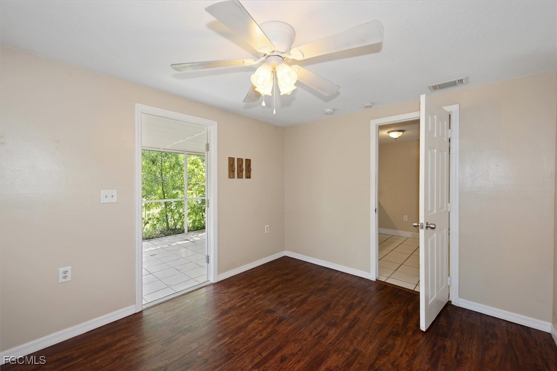 1905 Oakley Avenue, Unit A AND B Fort Myers, FL 33901 - Photo 25 of 30 an empty room with wooden floor and windows