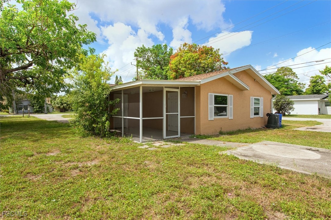 1905 Oakley Avenue, Unit A AND B Fort Myers, FL 33901 - Photo 29 of 30 a view of a house with a yard and potted plants