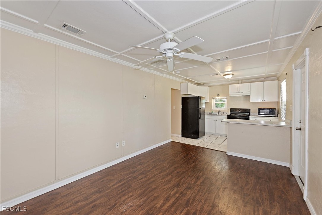 1905 Oakley Avenue, Unit A AND B Fort Myers, FL 33901 - Photo 7 of 30 a view of an empty room with kitchen appliances and wooden floor