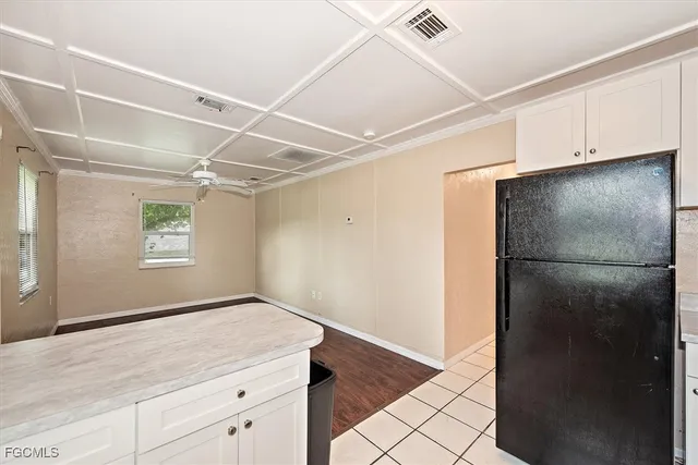 a view of a refrigerator in kitchen