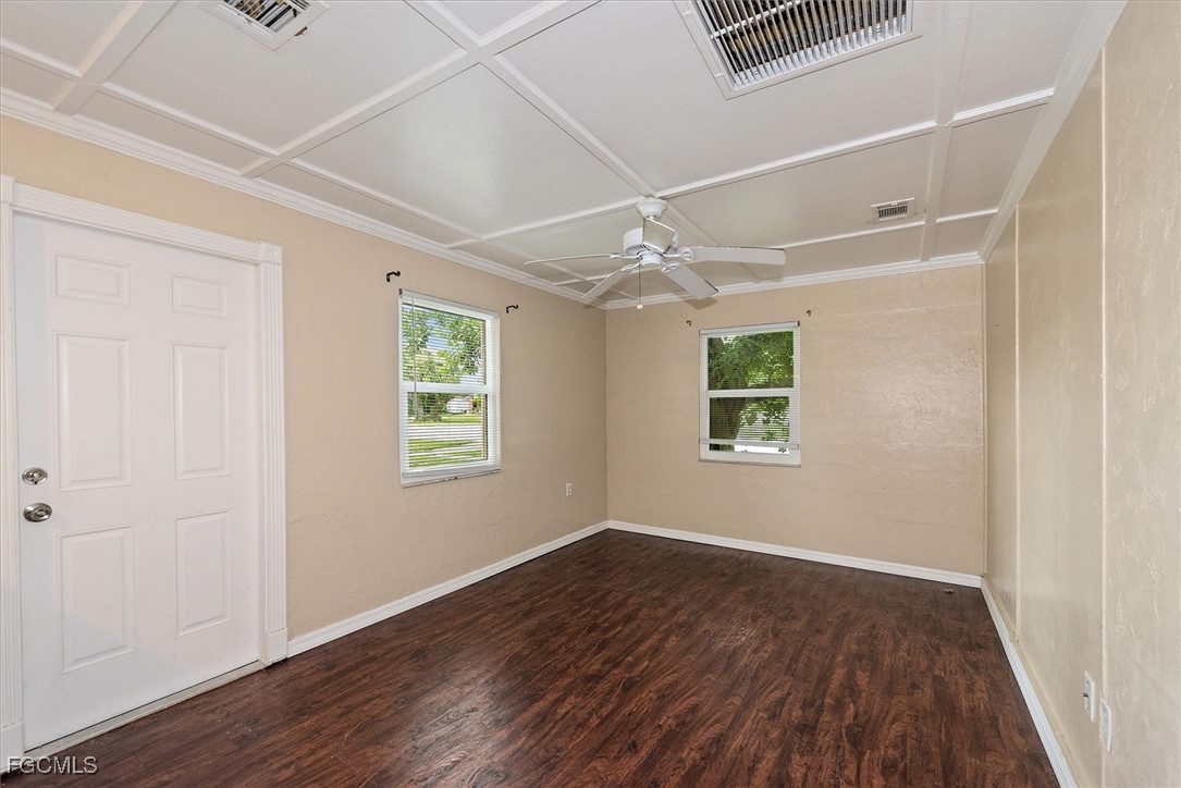 1905 Oakley Avenue, Unit A AND B Fort Myers, FL 33901 - Photo 9 of 30 a view of an empty room with wooden floor and a window