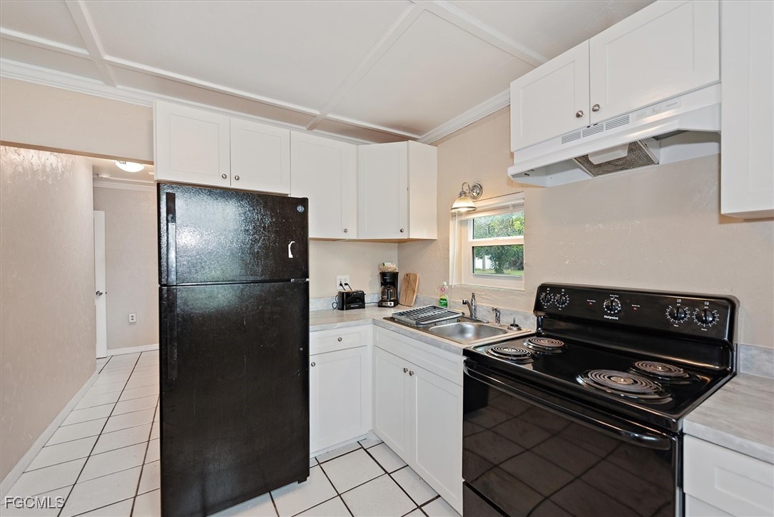 1905 Oakley Avenue, Unit A AND B Fort Myers, FL 33901 - Photo 10 of 30 a kitchen with a stove and a refrigerator