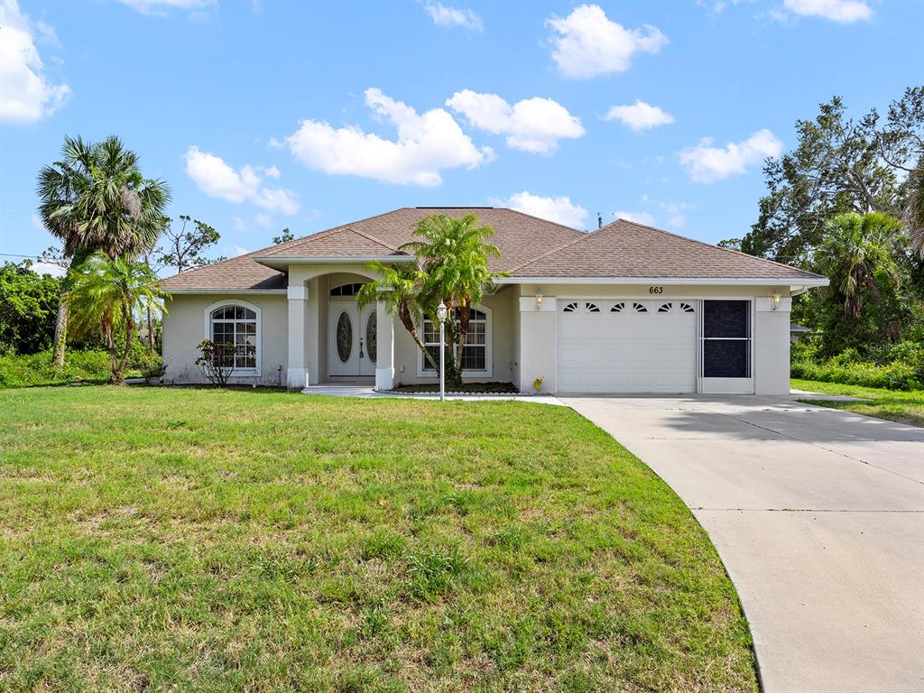 663 Nectar Road Venice, FL 34293 - Photo 1 of 1 a front view of a house with garden