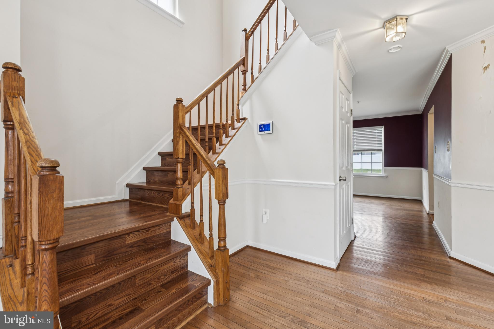 8305 Joan Place Clinton, MD 20735 - Photo 19 of 40 a view of entryway and hall with wooden floor