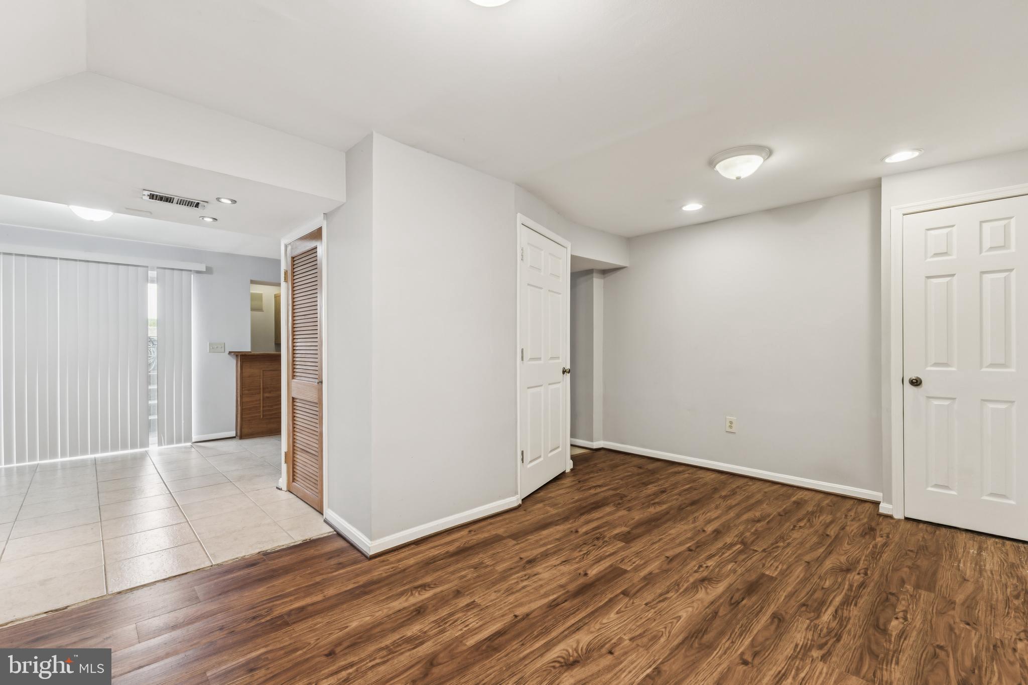 8305 Joan Place Clinton, MD 20735 - Photo 22 of 40 wooden floor in an empty room with wooden floor