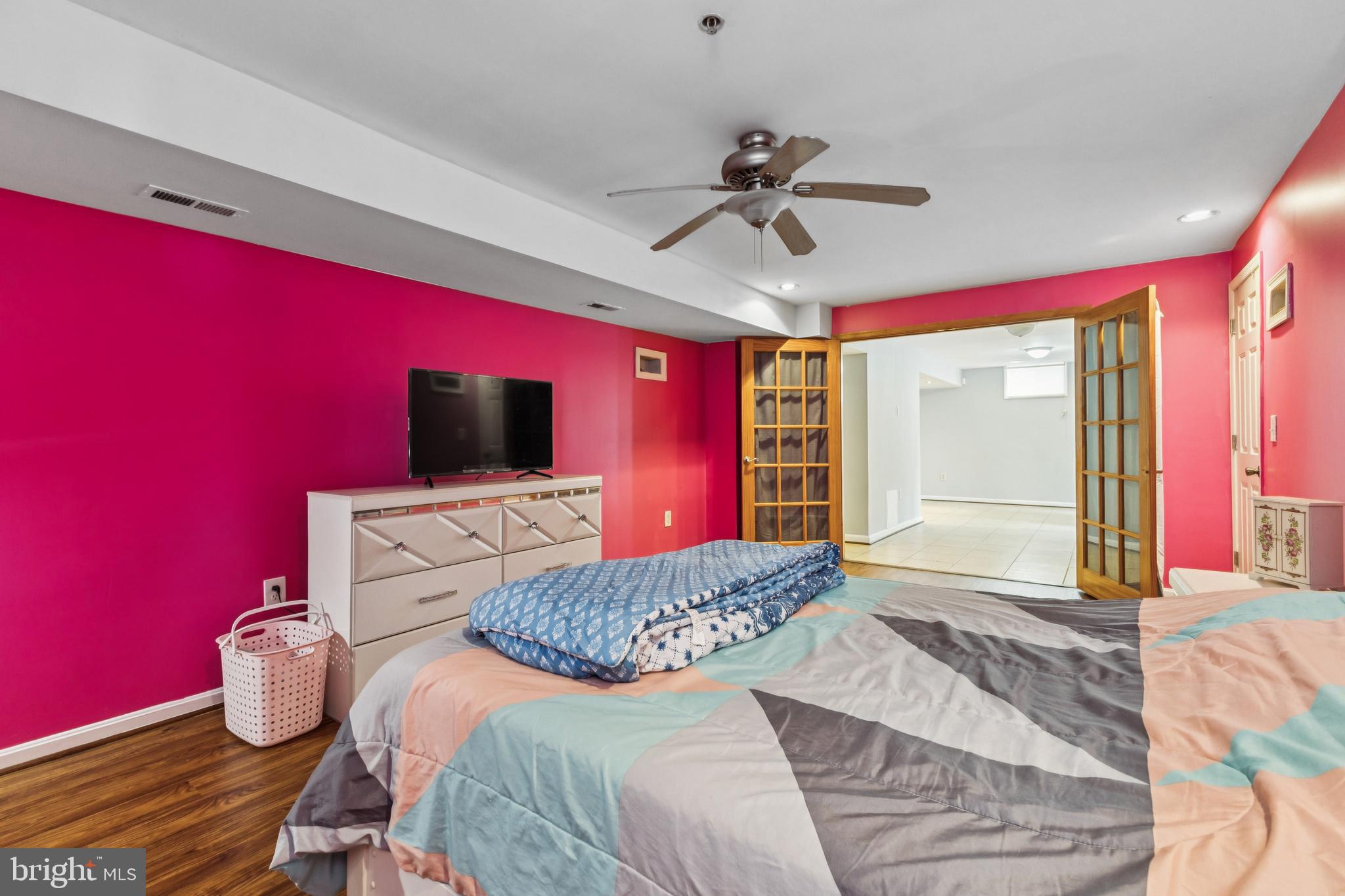 8305 Joan Place Clinton, MD 20735 - Photo 27 of 40 a bedroom with a bed and a flat screen tv