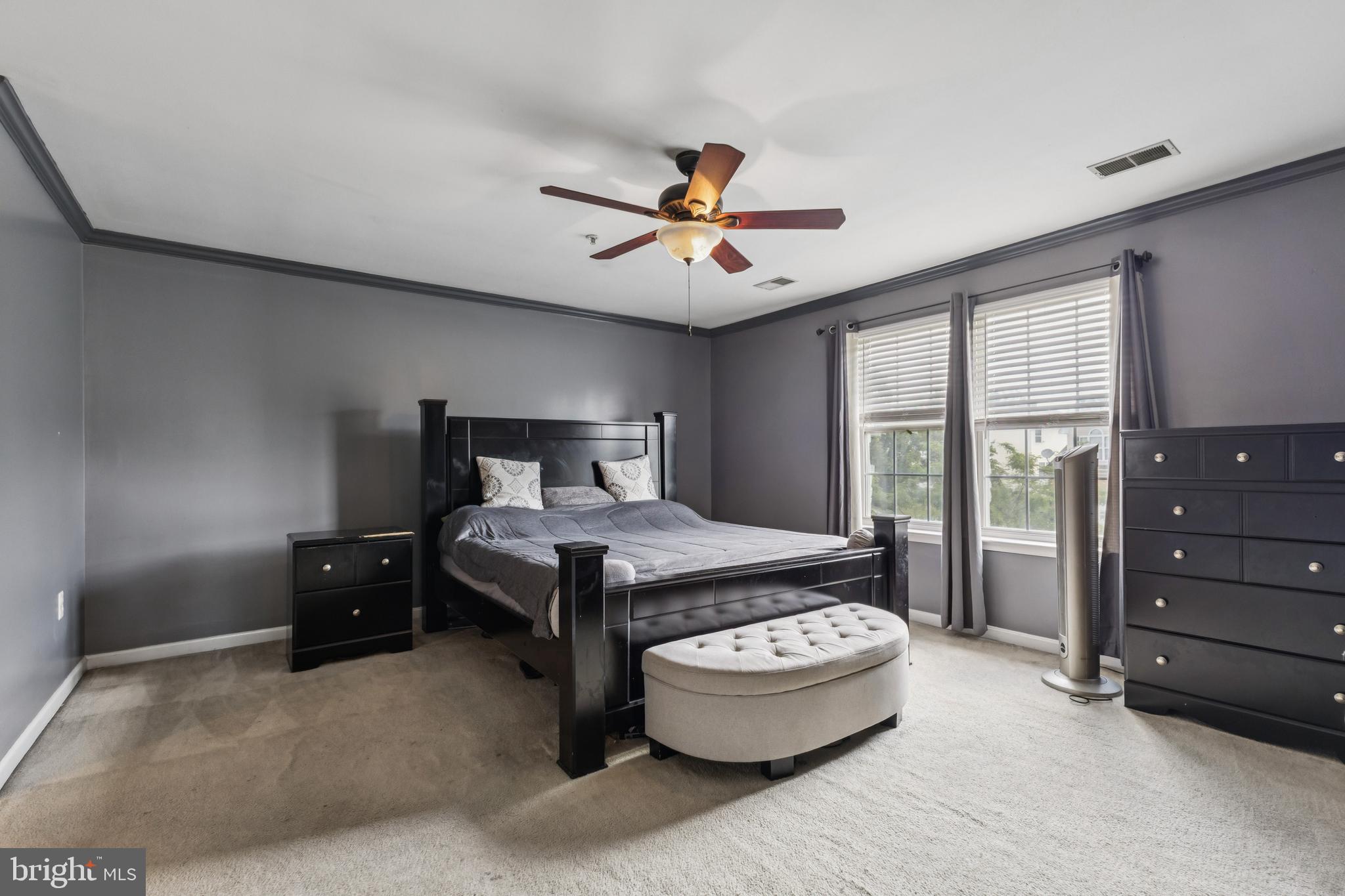 8305 Joan Place Clinton, MD 20735 - Photo 3 of 40 a bedroom with a bed and a chandelier