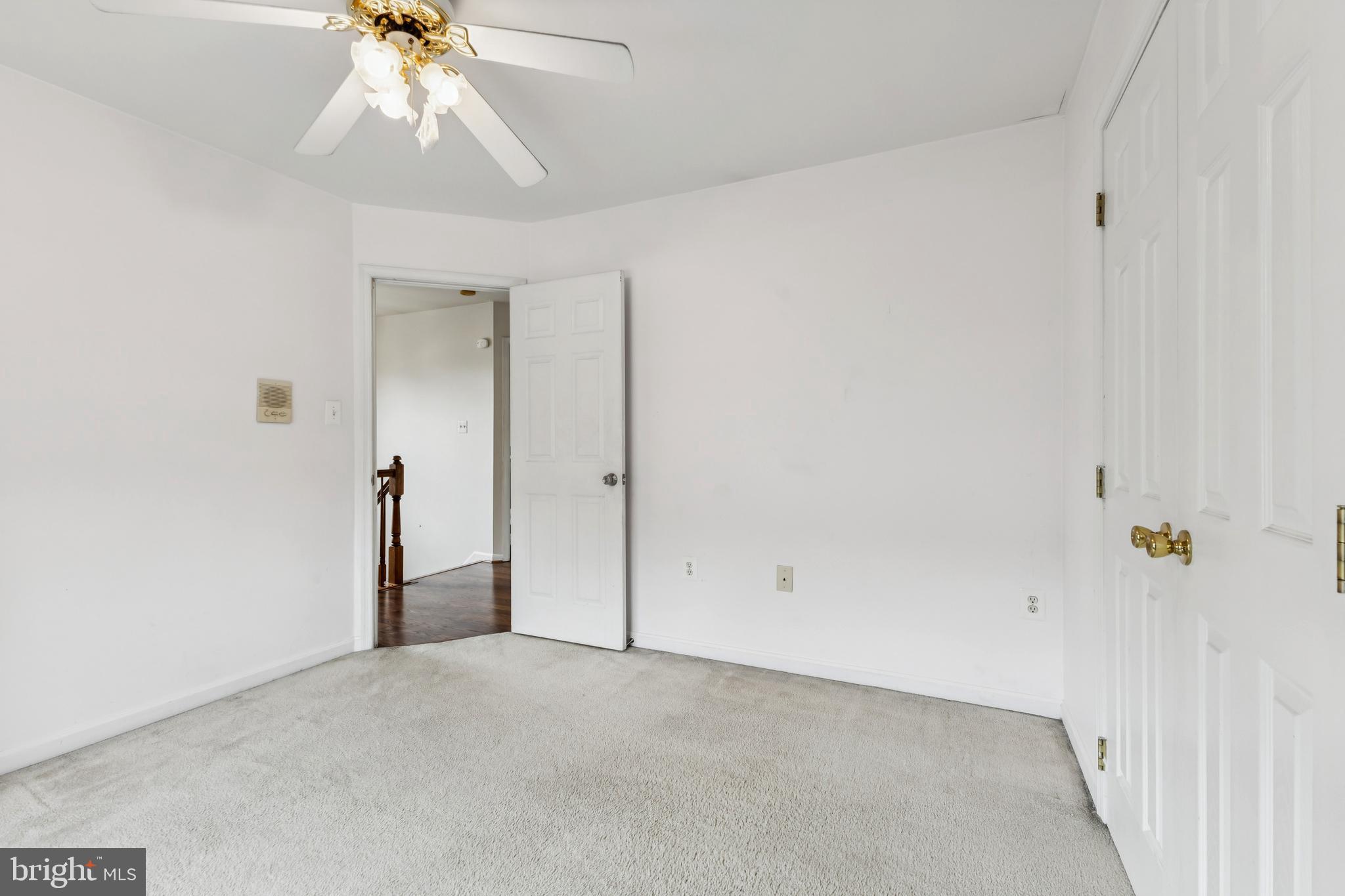 8305 Joan Place Clinton, MD 20735 - Photo 31 of 40 an empty room with a chandelier fan