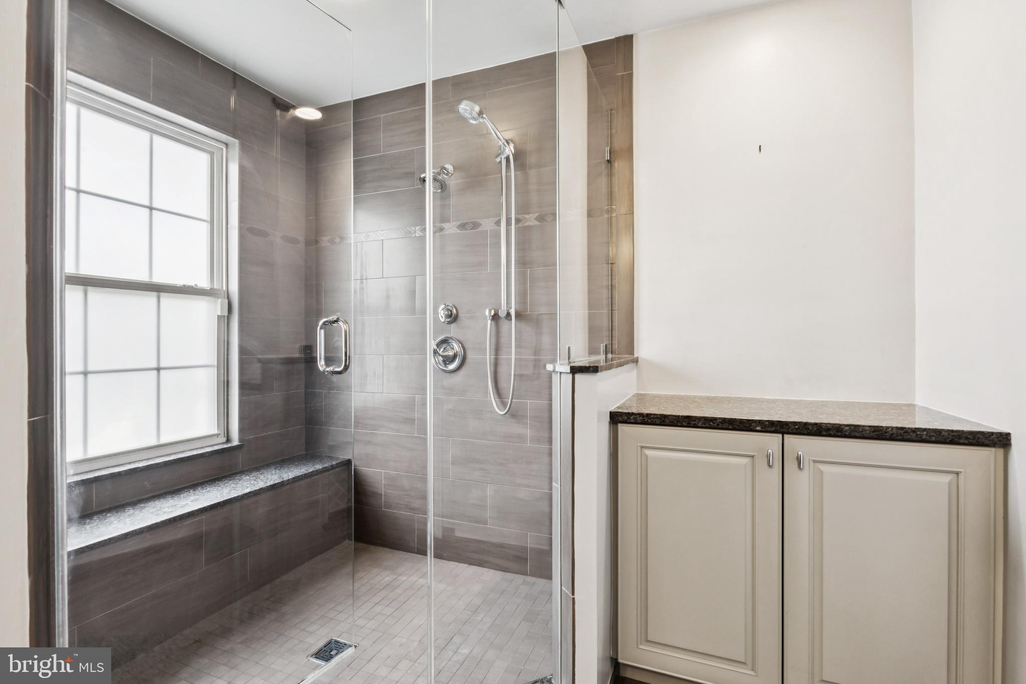 8305 Joan Place Clinton, MD 20735 - Photo 4 of 40 a bathroom with a bathtub and a shower