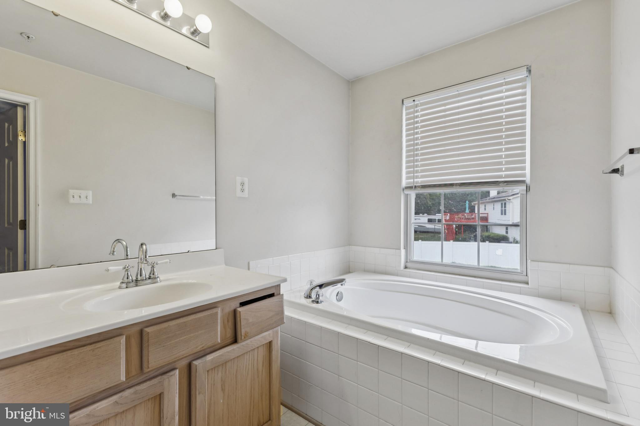 8305 Joan Place Clinton, MD 20735 - Photo 6 of 40 a bathroom with a sink and a bathtub
