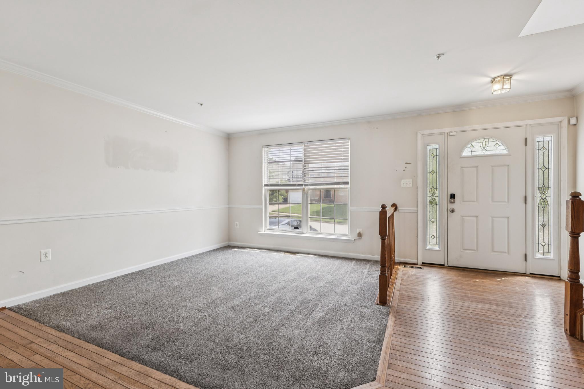 8305 Joan Place Clinton, MD 20735 - Photo 10 of 40 a view of empty room with wooden floor and fan