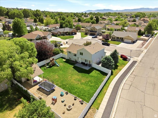 2247 South 425 West Perry, UT 84302 - Photo 27 of 29 Two-story residence with a tan exterior and a brown shingle roof
