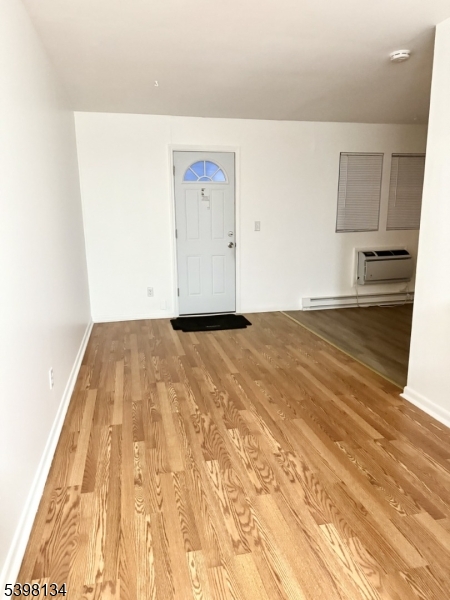 469 River Styx Road, Unit 29 Hopatcong, NJ 07843 - Photo 4 of 9 a view of empty room with wooden floor